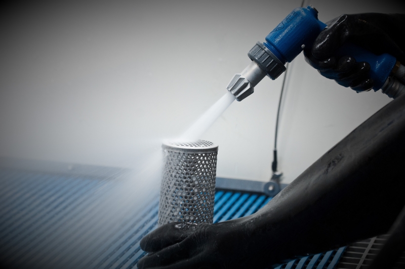 Wet blasting a perforated tube with the process gun