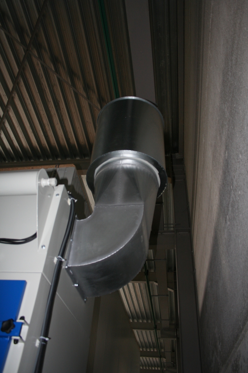 Silencieux à la sortie d'une installation de dépoussiérage