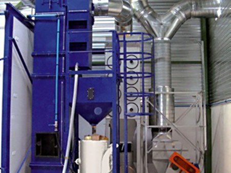 Bucket elevator with separator and storage silo beside a blast room