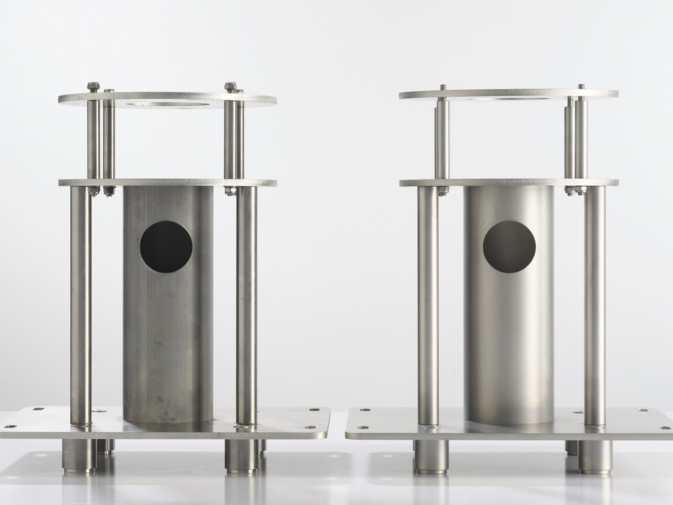 Two welded stainless steel frames with cylinder