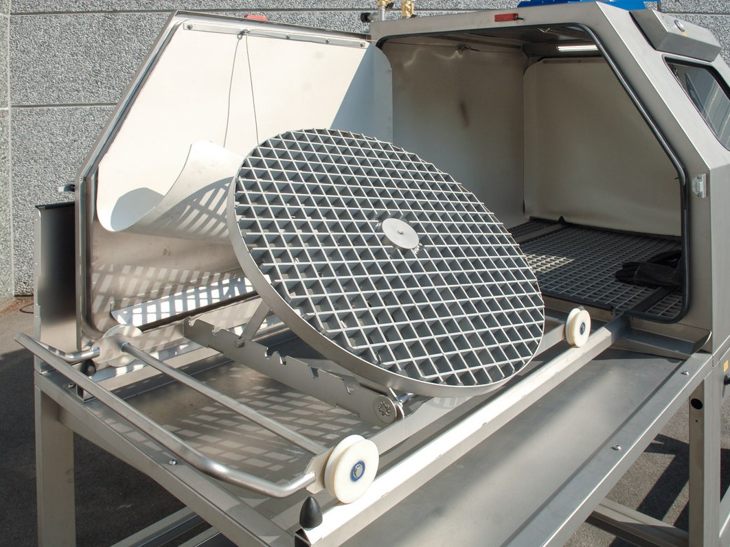 Open Mistral cabinet with the tilted turntable on the loading trolley