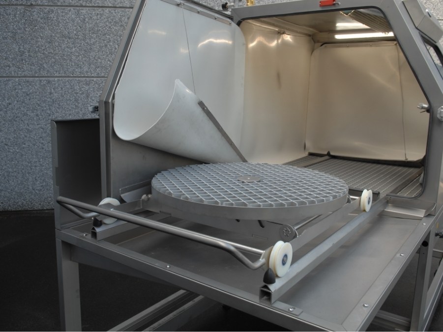 Opened Mistral cabinet with the turntable on the loading trolley