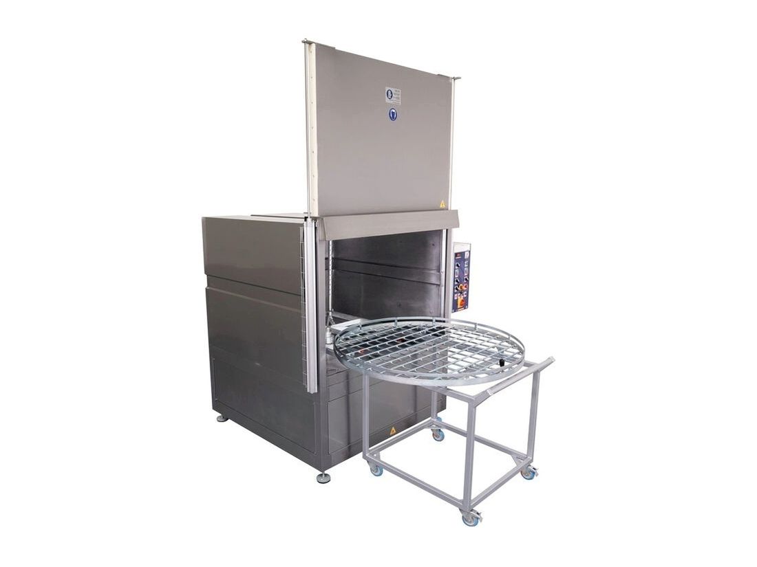Front loading spray parts washer with the front door open and a view of the rotating basket